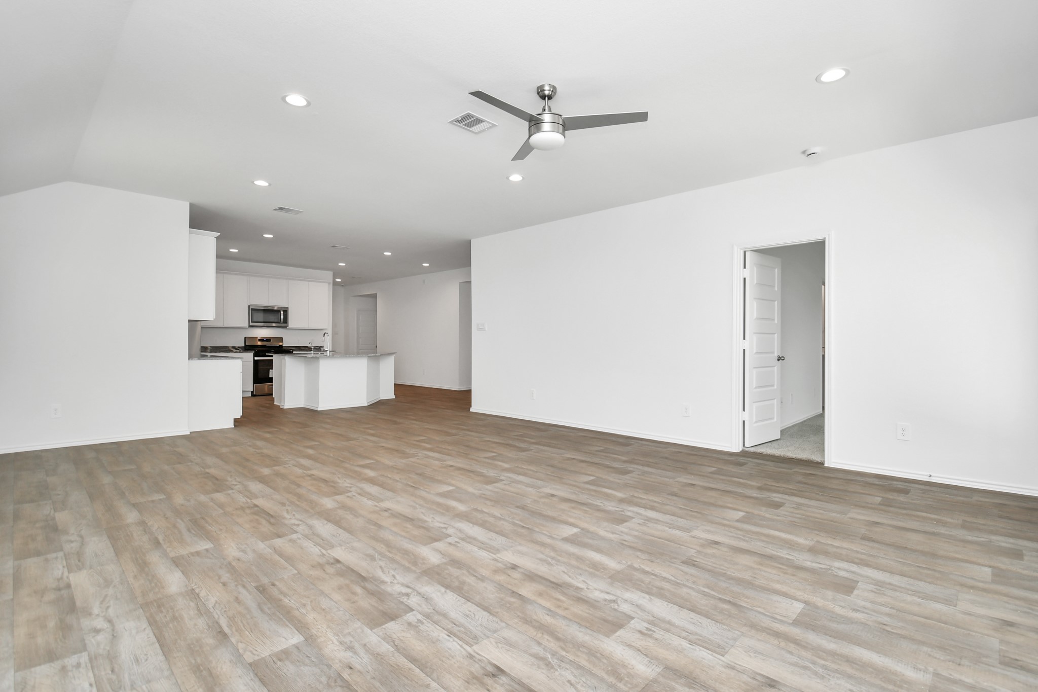 2715 Willow Gulch Way Rosenberg, TX 77469 - Photo 23 of 39 a view of a kitchen with a sink and cabinets