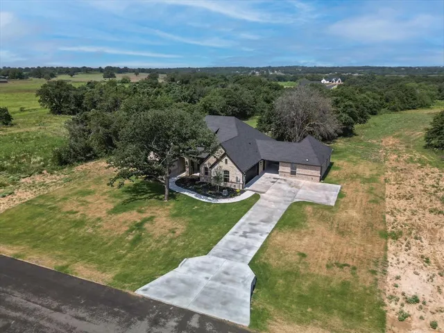 an aerial view of a house with a garden