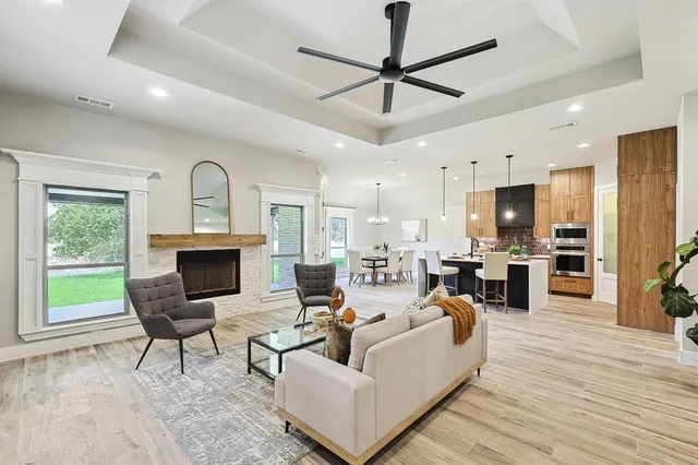 a living room with furniture and kitchen view