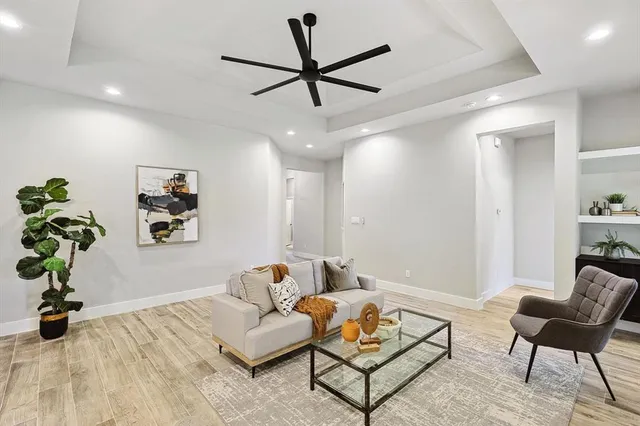 a living room with furniture and a fireplace