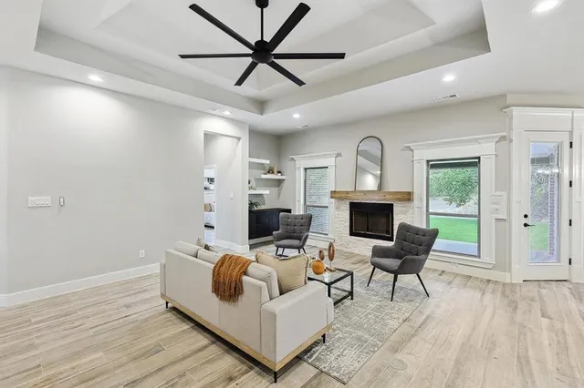 a kitchen with a sink a counter space appliances and cabinets