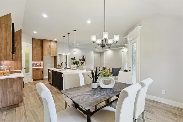 a bedroom with a large bed and a large window