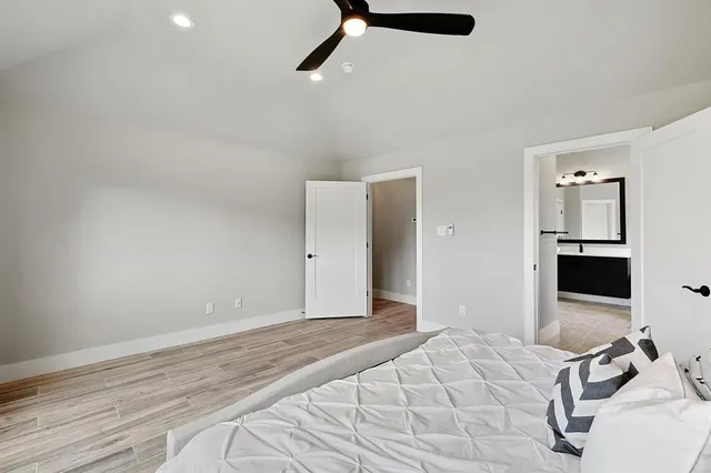 a bathroom with a sink toilet and mirror