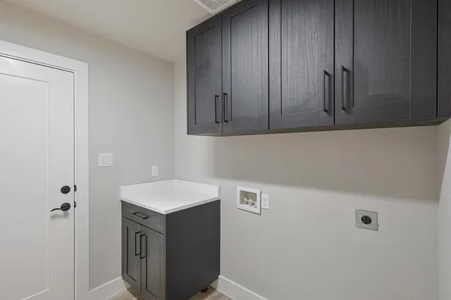 a view of a storage and utility room with closet
