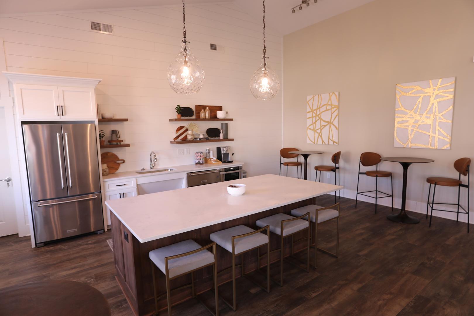 210 Grove Circle, Unit 103 Lillington, NC 27546 - Photo 10 of 13 a large kitchen with a table and chairs