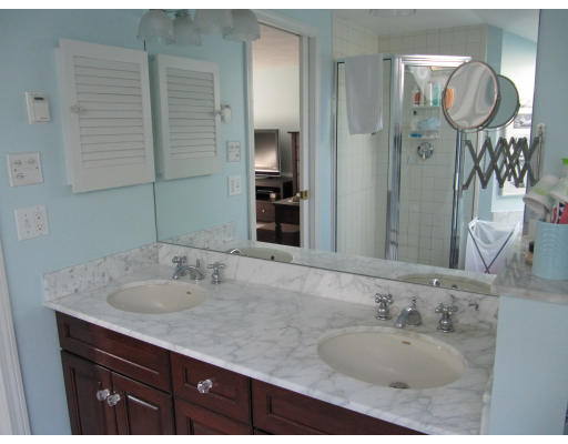 40 Pond Street Needham, MA 02492 - Photo 14 of 17 a bathroom with a granite countertop sink and a mirror