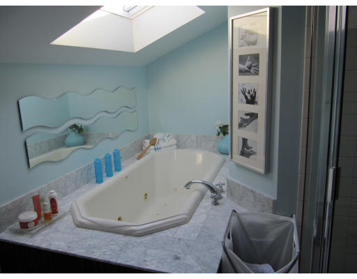 40 Pond Street Needham, MA 02492 - Photo 15 of 17 a bathroom with a tub sink and mirror