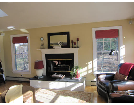 40 Pond Street Needham, MA 02492 - Photo 4 of 17 a living room with furniture and a fireplace