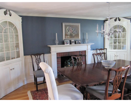 40 Pond Street Needham, MA 02492 - Photo 7 of 17 a dining room with furniture a fireplace and wooden floor