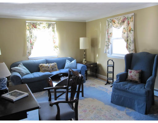40 Pond Street Needham, MA 02492 - Photo 8 of 17 a living room with furniture a large window and a dining table