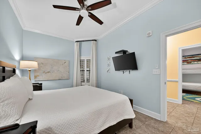 a bedroom with furniture and a chandelier