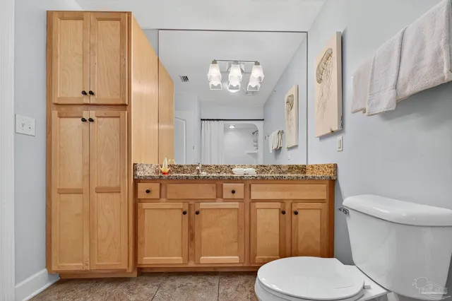 a balcony with table and chairs