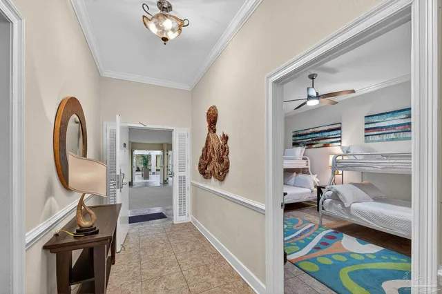 a living room with furniture a flat screen tv and a large window