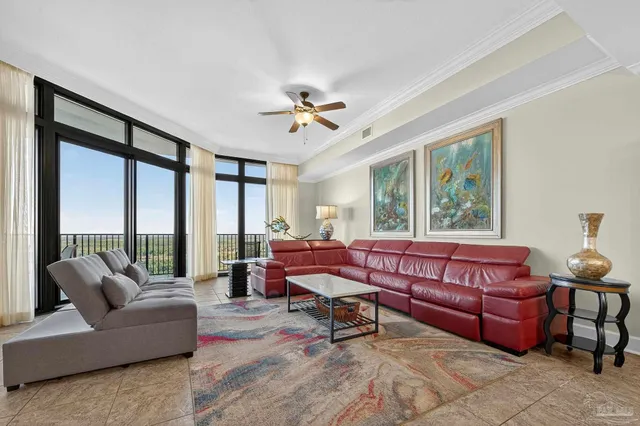 a living room with furniture and a large window