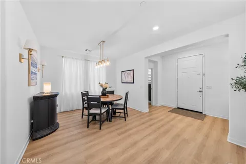 a view of a livingroom with furniture and wooden floor
