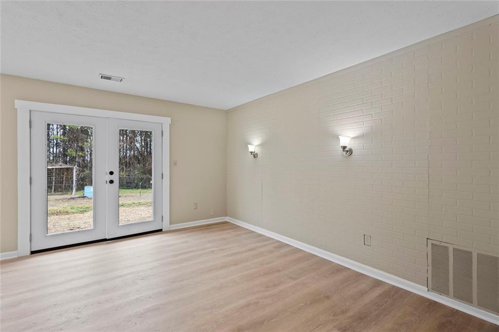 1201 Shoreham Drive Atlanta, GA 30349 - Photo 2 of 21 a view of an empty room with window