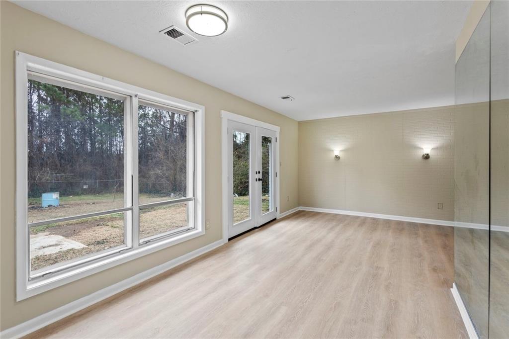 1201 Shoreham Drive Atlanta, GA 30349 - Photo 5 of 21 a view of an empty room with glass door