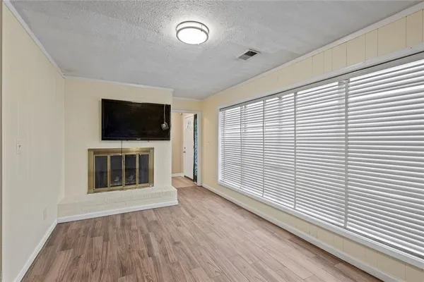 a view of a livingroom with furniture and fireplace