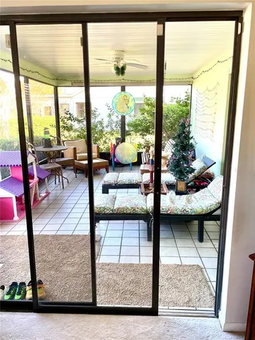 a living room with furniture rug and a table