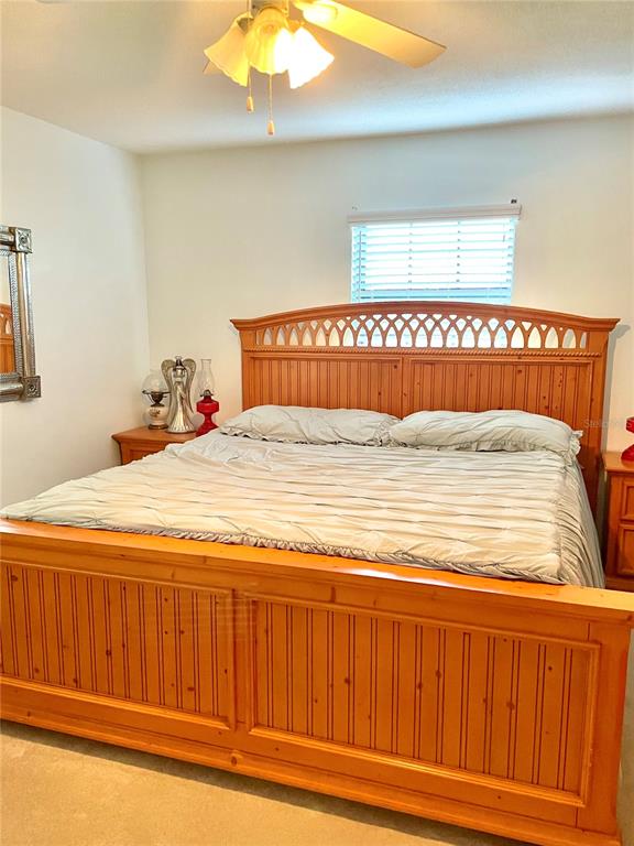 3401 Divot Road Sebring, FL 33872 - Photo 27 of 34 a bedroom with a bed and a window