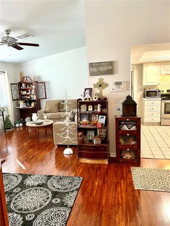 a dining room with furniture and wooden floor
