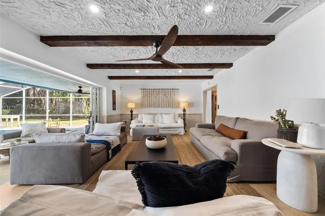 a view of a living room and balcony