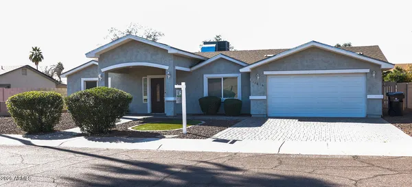 a front view of a house with yard