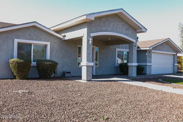 a front view of a house with parking space