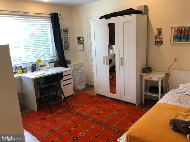 a bathroom with a toilet a sink and a mirror