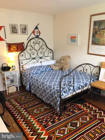 a bedroom with a bed and a table in it