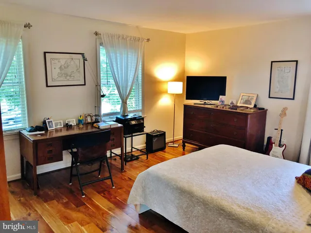 a bedroom with a bed and a table in it