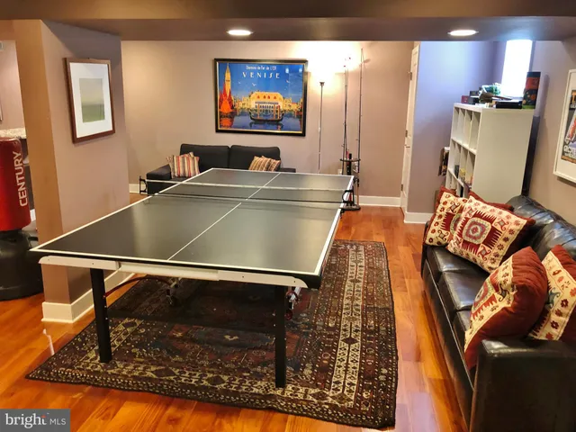 a lobby with furniture and stairs