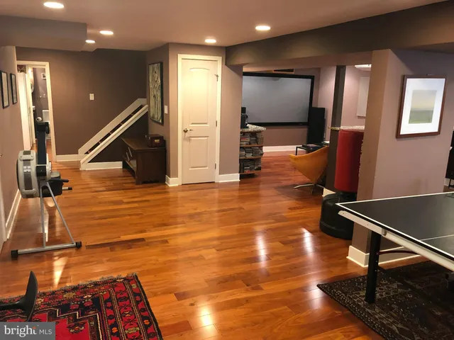 a bathroom with a sink mirror and toilet