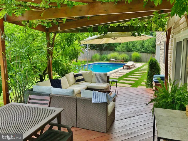 a view of swimming pool with chairs