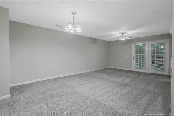 a view of empty room with windows