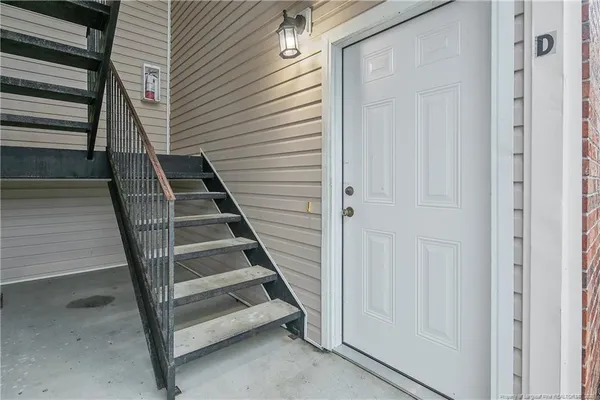 a view of entryway with wooden floor