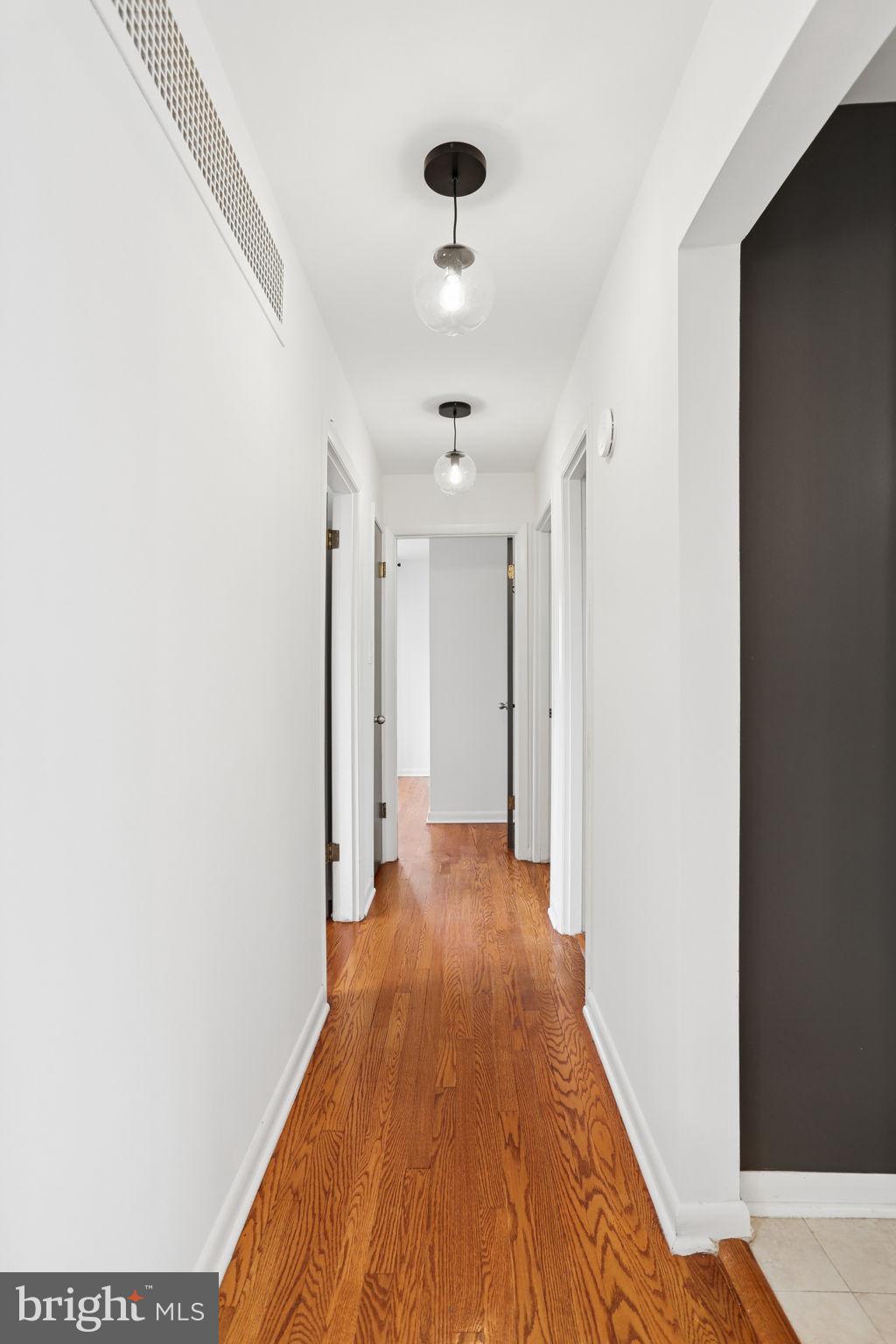 5909 Ridge View Drive Alexandria, VA 22310 - Photo 14 of 35 a view of a hallway with wooden floor