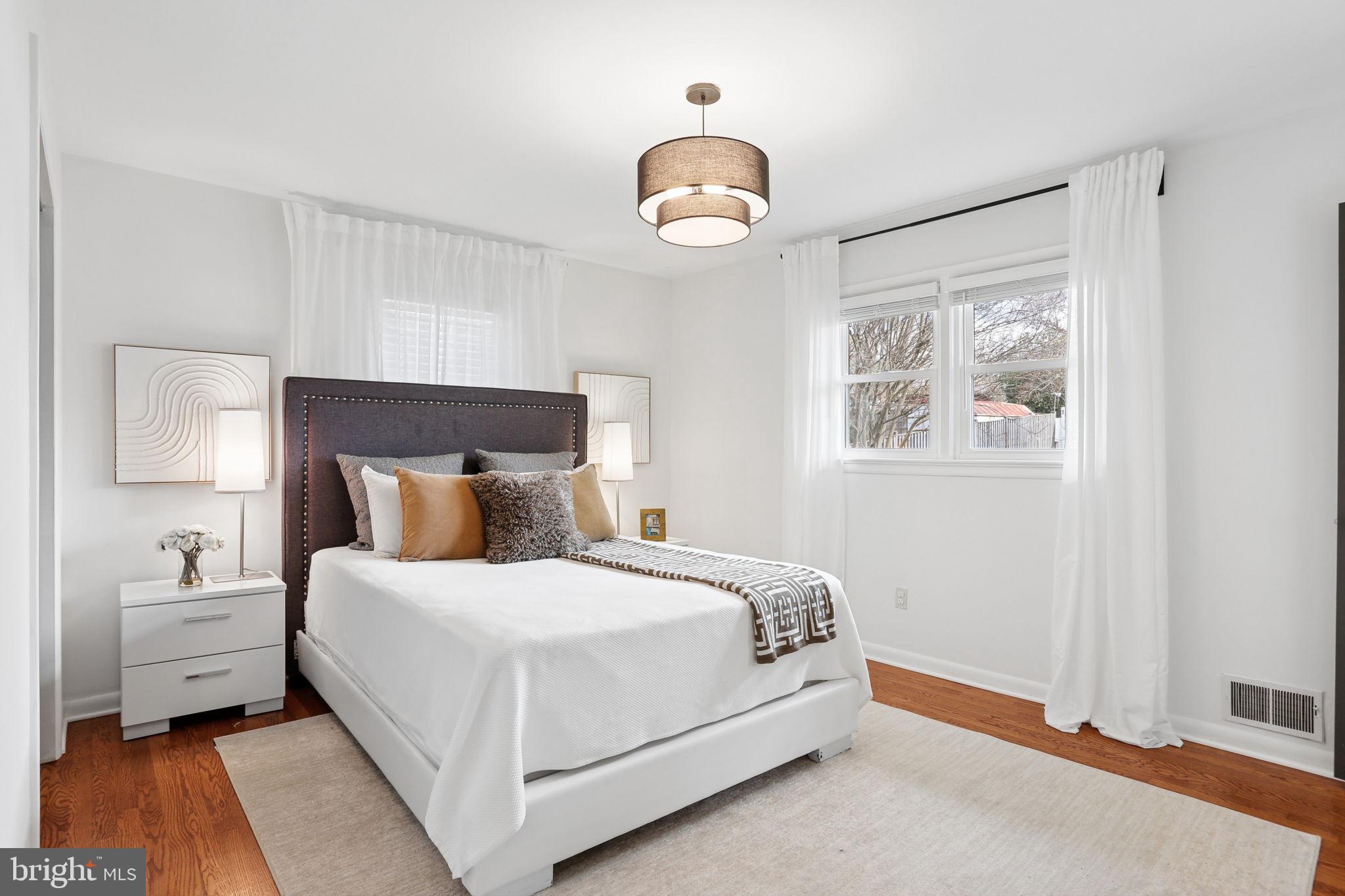 5909 Ridge View Drive Alexandria, VA 22310 - Photo 15 of 35 a bedroom with a bed and a window