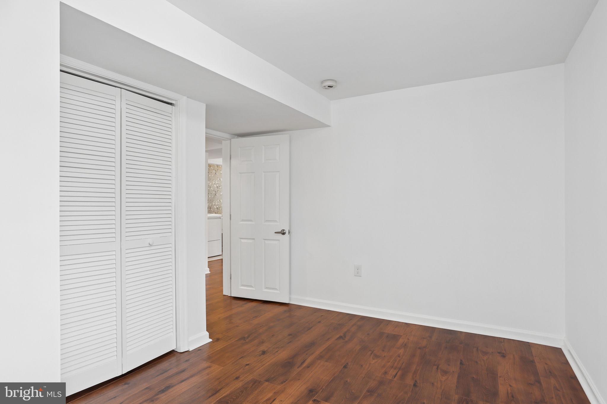 5909 Ridge View Drive Alexandria, VA 22310 - Photo 28 of 35 a view of an empty room with wooden floor