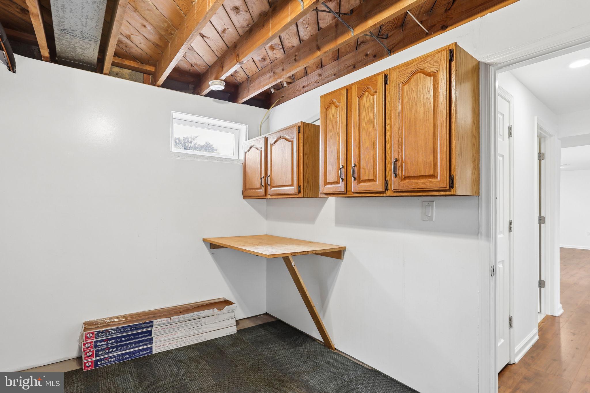 5909 Ridge View Drive Alexandria, VA 22310 - Photo 30 of 35 a room with chair and wooden floor