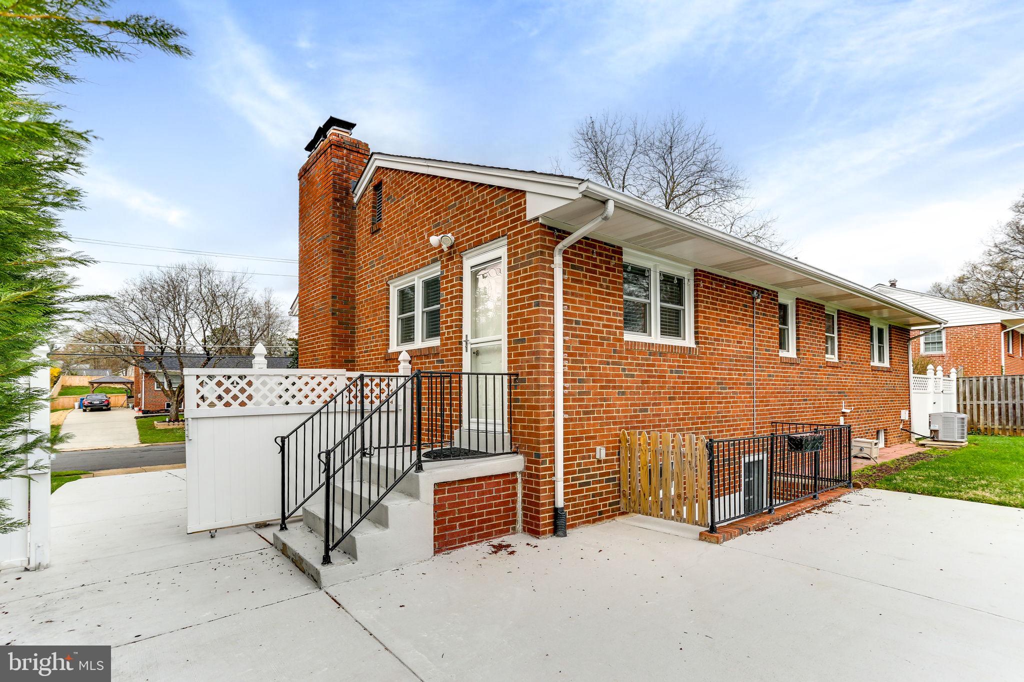 5909 Ridge View Drive Alexandria, VA 22310 - Photo 31 of 35 a view of a house with a wooden fence