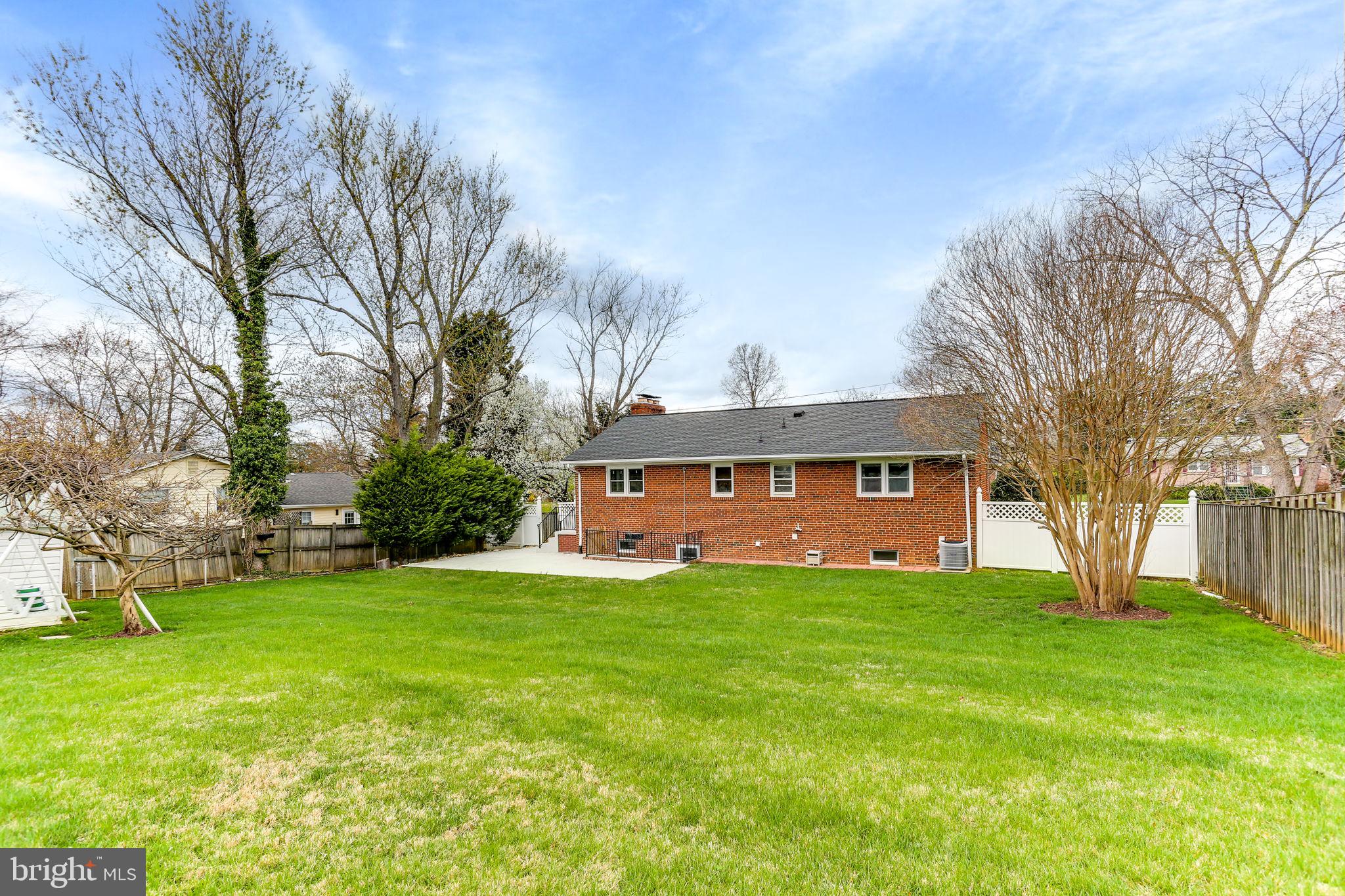 5909 Ridge View Drive Alexandria, VA 22310 - Photo 34 of 35 a view of a house with a big yard and large trees
