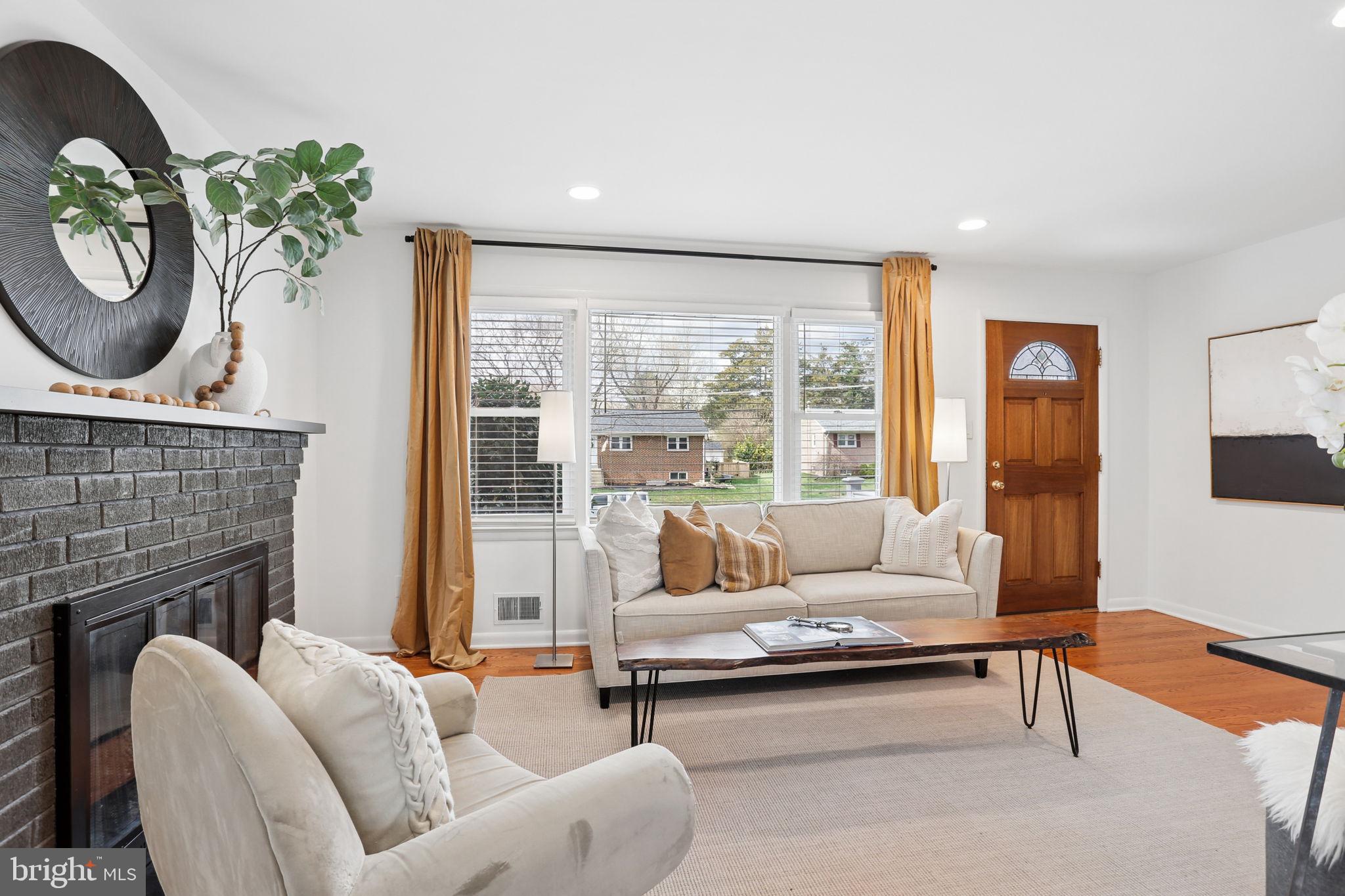 5909 Ridge View Drive Alexandria, VA 22310 - Photo 4 of 35 a living room with furniture and a fireplace