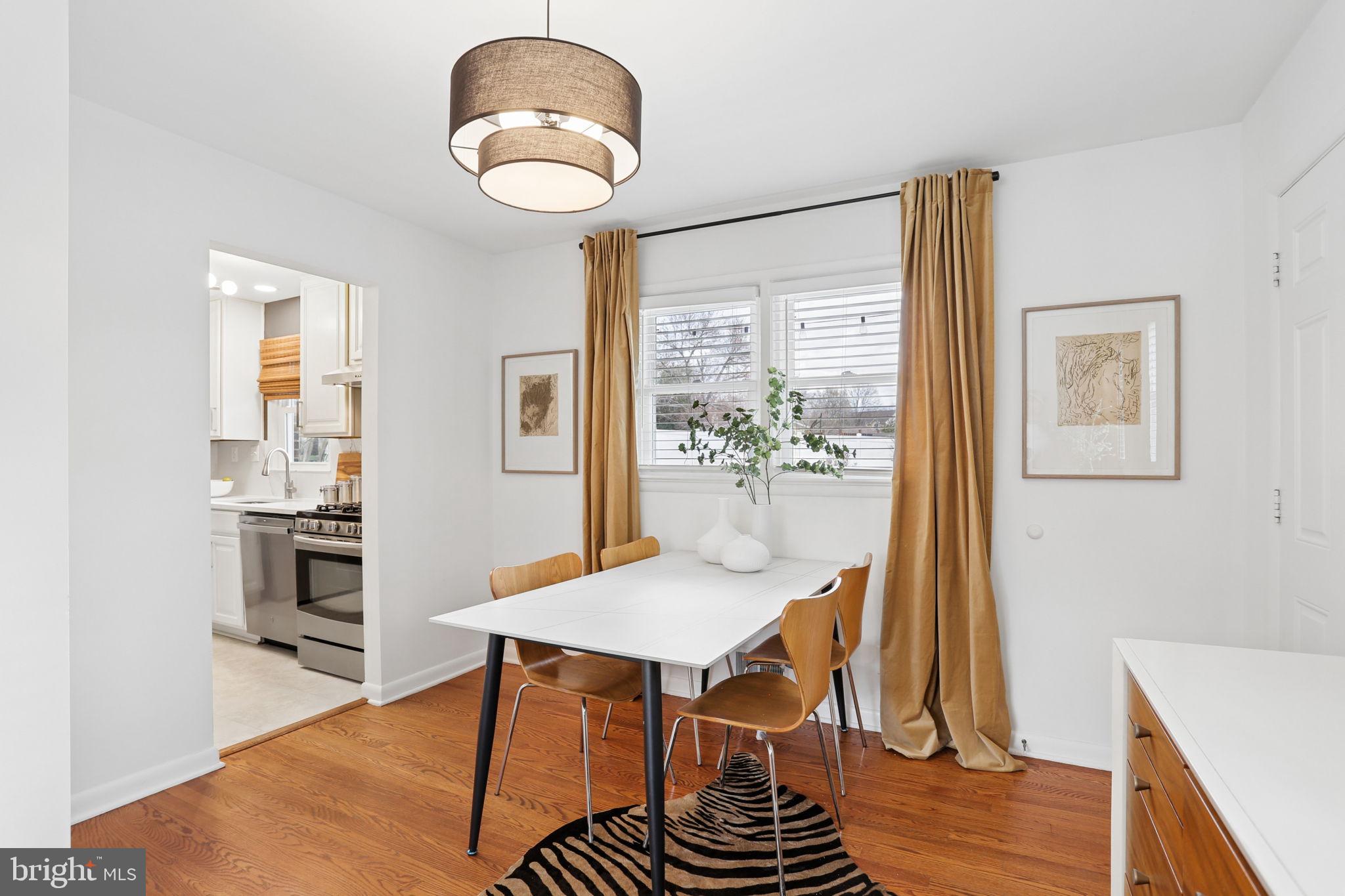 5909 Ridge View Drive Alexandria, VA 22310 - Photo 9 of 35 a view of a dining room with furniture window and wooden floor