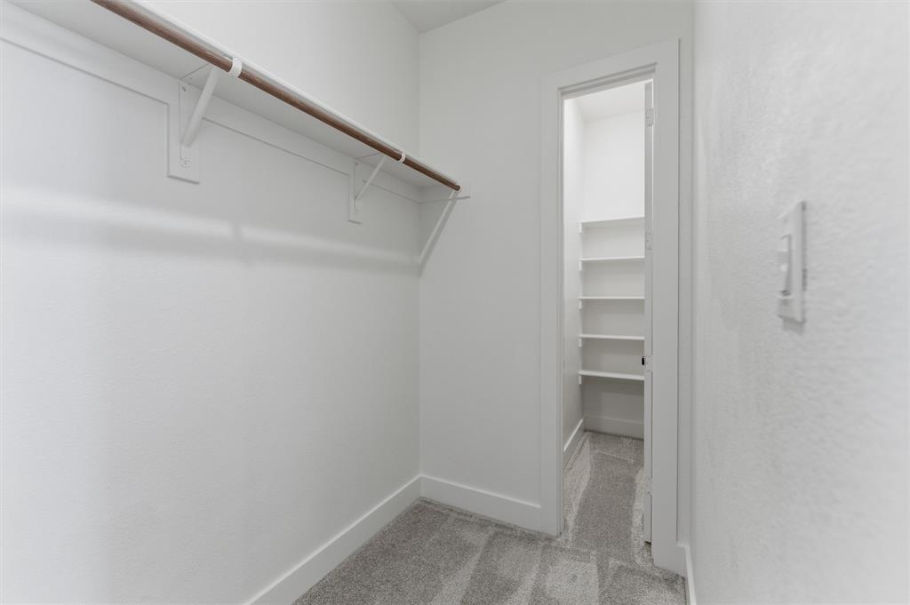 814 Vly Rdg Road Van Alstyne, TX 75495 - Photo 18 of 24 a view of walk in closet with empty racks