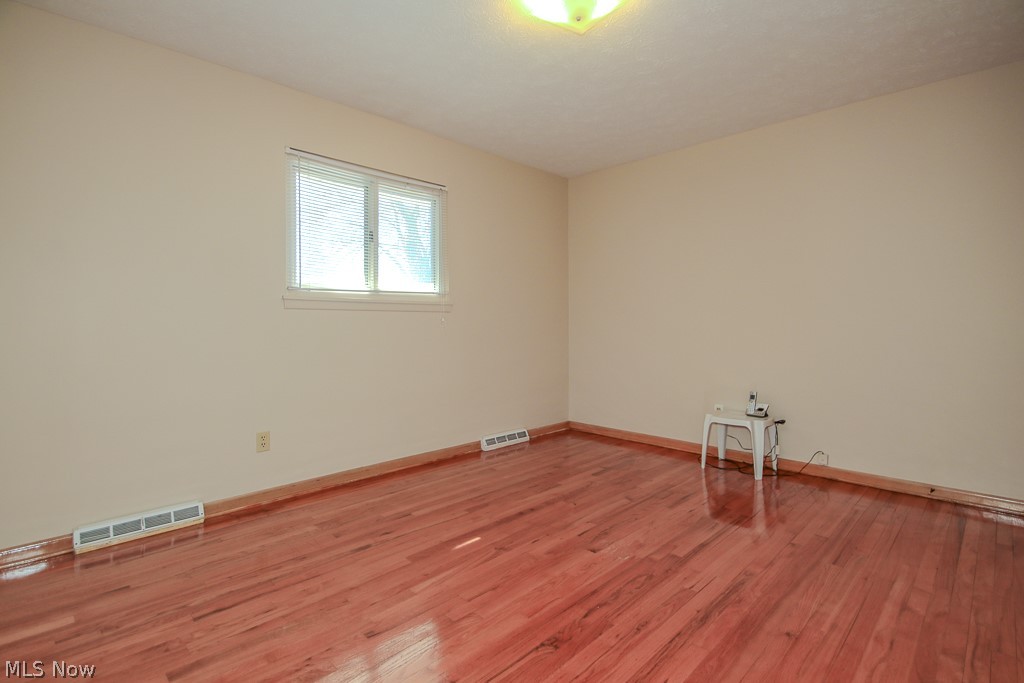 30224 Regent Road Wickliffe, OH 44092 - Photo 14 of 27 Unfurnished room featuring wood finished floors and baseboards