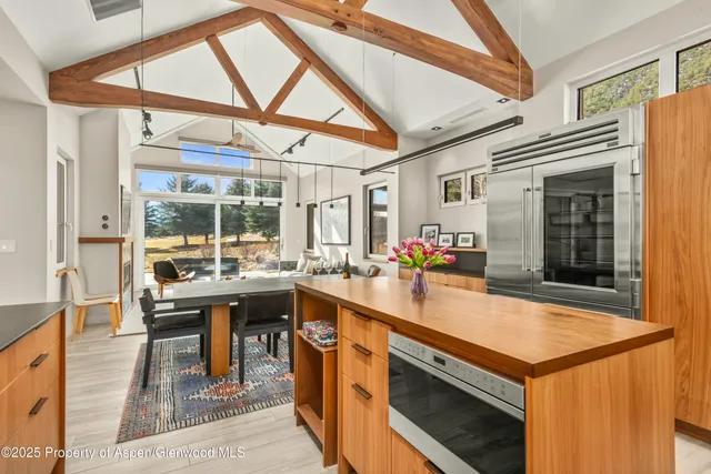 a kitchen with a stove a sink and a refrigerator