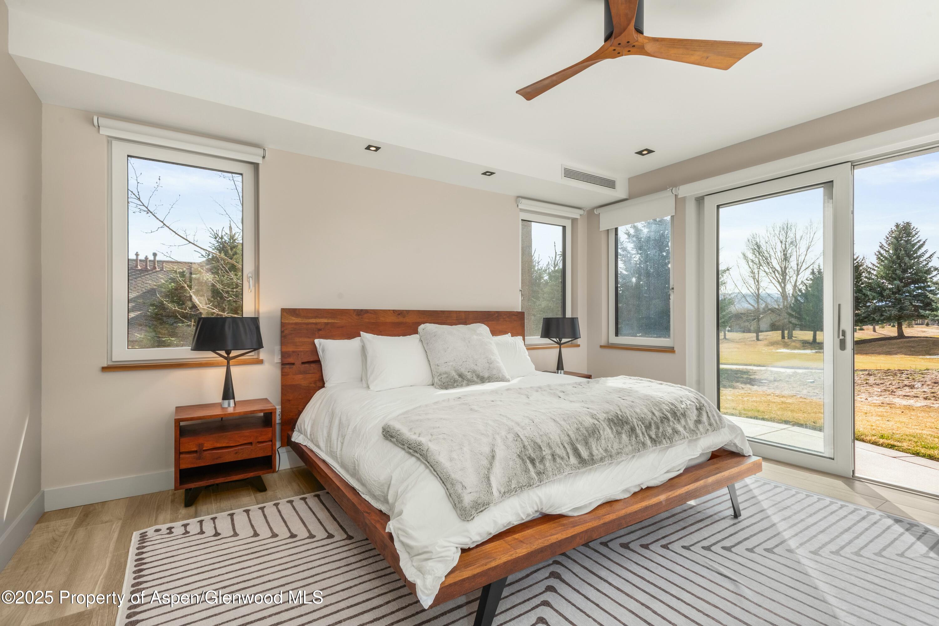 649 Saddleback Road Carbondale, CO 81623 - Photo 19 of 37 a bedroom with a bed and a large window