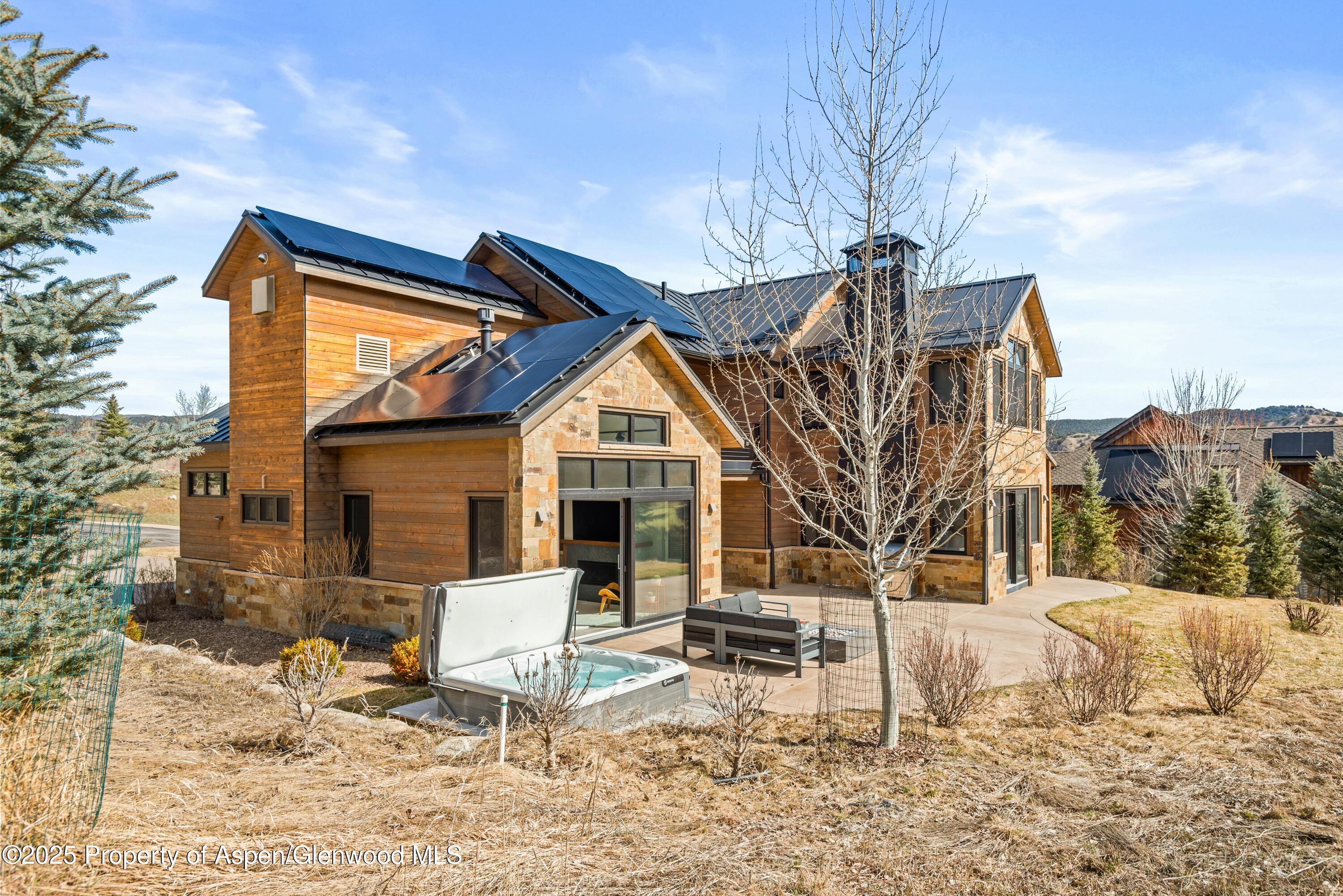649 Saddleback Road Carbondale, CO 81623 - Photo 2 of 37 a view of house with backyard and outdoor seating