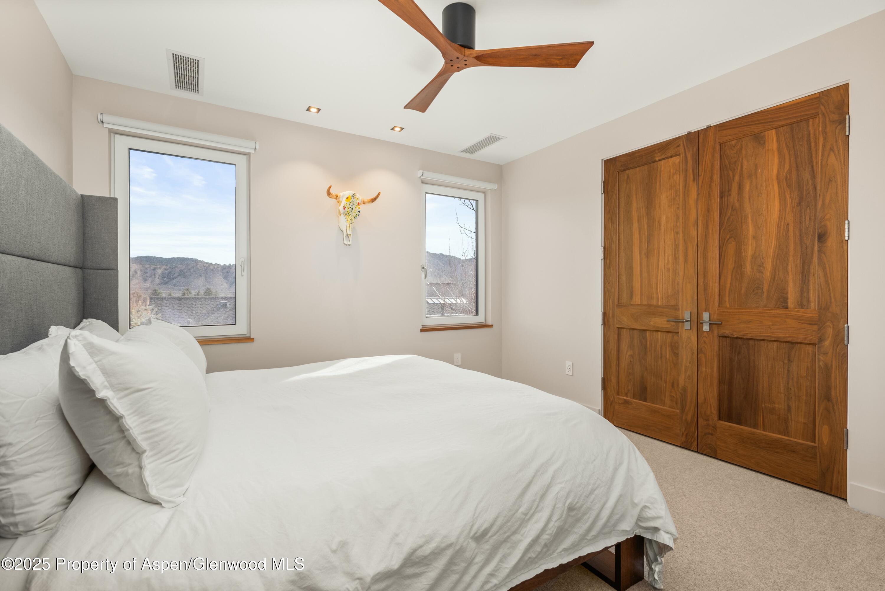 649 Saddleback Road Carbondale, CO 81623 - Photo 24 of 37 a bedroom with a bed and a window
